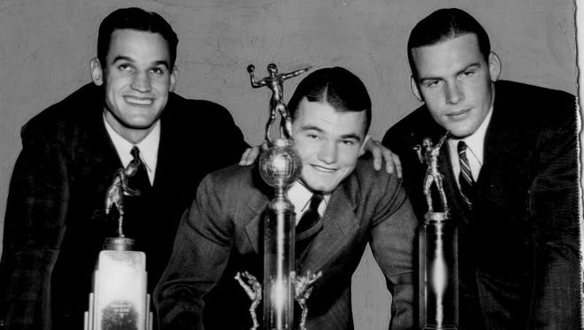 Jan. 17, 1940 - Ken Kavanaugh (LSU) with the Rockne Award, Kinnick (Iowa) with the Walter Camp Award and John Kimbrough (Texas A&M) with a Special Award in Washington D.C. at the Touchdown Club.