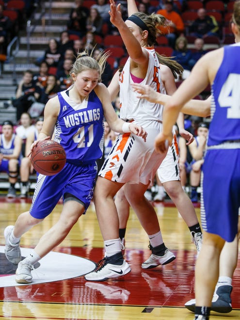 Newell-Fonda's Olivia Larsen (41) drives to the net during the second half of their 1A girls state basketball championship game at Wells Fargo Arena on Saturday, March 3, 2018, in Des Moines. Springville would go on to win 60-49.