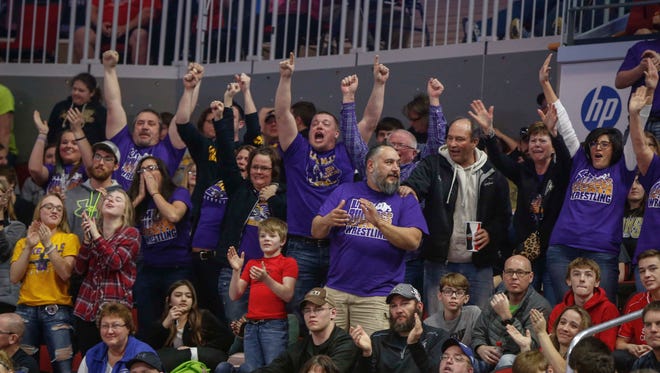 Lake Mills fans cheer as Slade Sifuentes won his second state title at 195 pounds during the Iowa Class 1A wrestling finals on Saturday, Feb. 18, 2017, at Wells Fargo Arena in Des Moines.