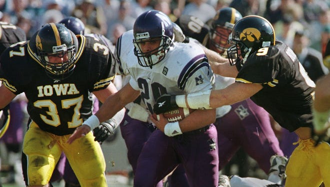 From 1998: Iowa's Matt Hughes (37) and Ryan Bowen (9) take down Northwestern's Damien Anderson.