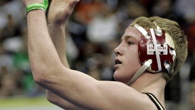 2008: Andrew Long, Creston/Orient-Macksburg looks up into the stands as he celebrates his third state title after defeating Tanner Weatherman, Ballard (Huxley)  in their 125 pound Class 2A championship match at the Iowa State High School Wrestling tournament.