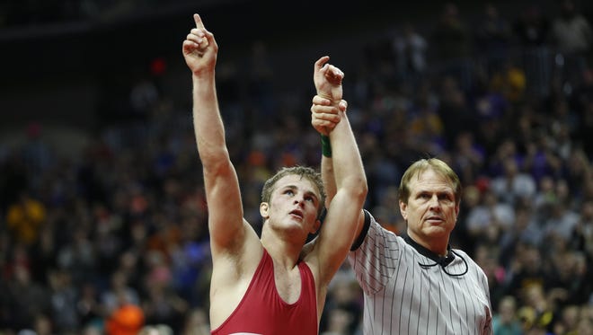 Lisbon's Carter Happel celebrates his win in the 145 title match Saturday, Feb. 20, 2016 during the class 1A state wrestling tournament finals in Des Moines.
