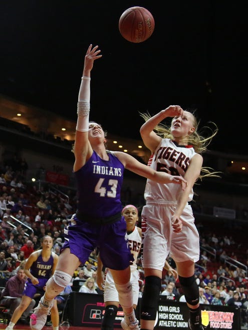 Indianola senior Grace Berg tries to get a shot over Cedar Falls senior Cynthia Wolf. Seventh-seeded Indianola beat second-seeded Cedar Falls 64-63 in a Class 5A state quarterfinal at Wells Fargo Arena in Des Moines Feb. 26.