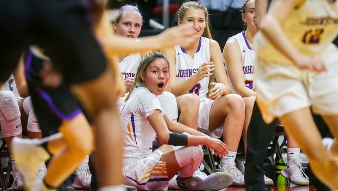 Johnston's starters watch the final seconds of their win over Waukee in their first round 5A matchup in the girls' state basketball tournament Monday, Feb. 26, 2018, at Wells Fargo Arena in Des Moines, Iowa. Johnston defeated Waukee 73-48.