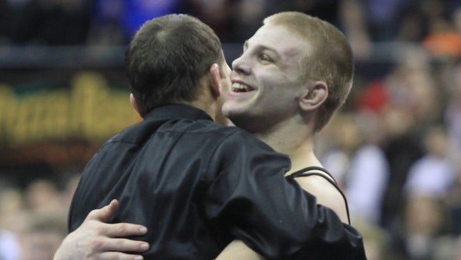 2013: Jake Marlin of Creston-OM celebrates after defeating Adam Staudt of Charles City in the 138-pound final at the Iowa state wrestling tournament on Saturday, Feb. 16, 2013 at Wells Fargo Arena in Des Moines, Iowa. (Charlie Litchield/The Des Moines Register)