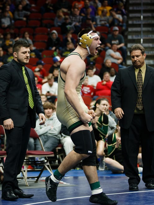 Francis Duggan Iowa City West celebrates a 13-4 win over Greg Hagan of Dowling Catholic during their class 3A 220 pound championship match at Wells Fargo Arena on Saturday, Feb. 17, 2018, in Des Moines.