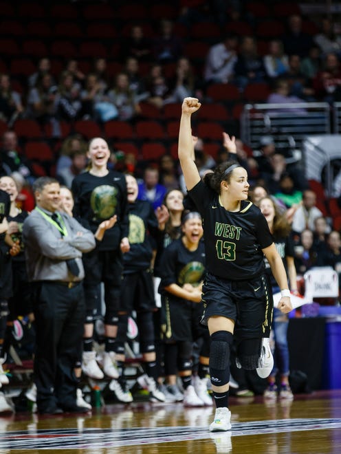 Iowa City, West's Rachael Saunders (13) celebrates a three point shot during the second half of their 5A state championship game at Wells Fargo Arena on Friday, March 2, 2018, in Des Moines. West would go on to win 56-45.