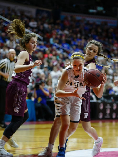 Cascade's Nicole McDermott (0) fights for a rebound during the second half of their 2A girls state basketball championship game at Wells Fargo Arena on Saturday, March 3, 2018, in Des Moines. Cascade would go on to win 41-37.