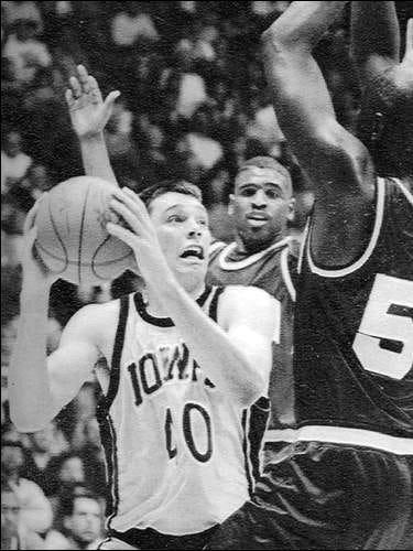 Street works inside against Minnesota defenders in a game Jan. 13, 1993, less than a week before his car accident.