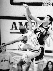 Dec. 22, 1992: Chris Street tips the ball away from Chris Lowery of Southern Illinois during the title game of the San Juan Shoot-Out. Iowa won 90-70.
