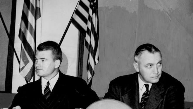 Dec. 5, 1941 - Nile Kinnick at the football banquet of his high school alma mater, Benson H.S. in Omaha. Kinnick is sitting next to his high school coach Ernest Adams. It was Kinnick's last public appearance before joining the Naval Reserve air corps.