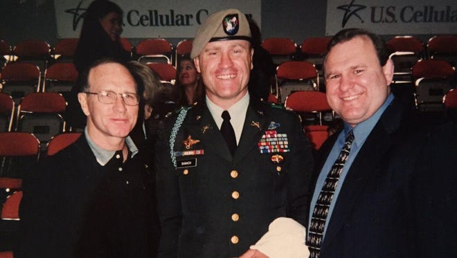 Dan Gable, left, Steve Banach, center, and Ed Banach in 2002.