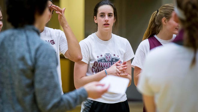 Caitlin Clark, a West Des Moines Dowling Catholic guard, listens to head coach Kristin Meyer during practice Tuesday, Feb. 13, 2018, in West Des Moines.