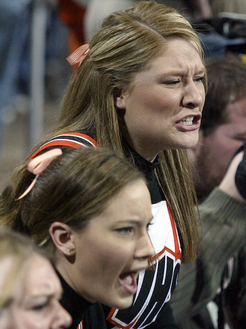 From 2004: West Des Moines Valley cheerleader Tara DeBartolo roots on Tigers during state wrestling at Veterans Memorial Auditorium in Des Moines.