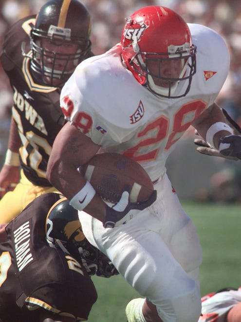 From 1998: Iowa State tailback Darren Davis races past Iowa defenders Tarig Holman, bottom, and Aron Klein to score a touchdown in the Cyclones' 27-9 victory at Kinnick Stadium.