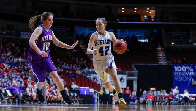 Newell-Fonda's Ella Larsen drives the ball inside as Kee High's Kendra Cooper chases her during the 2018 Iowa Class 1A girls state basketball quarterfinal game on Tuesday, Feb. 28, 2018, at Wells Fargo Arena in Des Moines