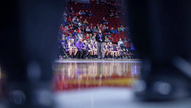 Kee High coach Lisa Steckel is framed by the feet of a game official against Newell-Fonda during the 2018 Iowa Class 1A girls state basketball quarterfinal game on Tuesday, Feb. 28, 2018, at Wells Fargo Arena in Des Moines