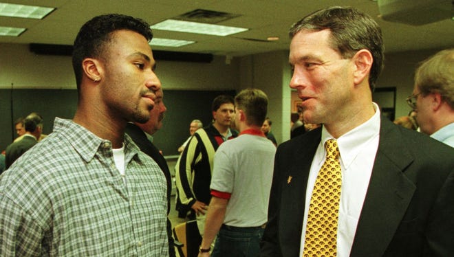 From 1998: New Iowa football coach Kirk Ferentz talks with Hawkeyes wide receiver Kahlil Hill following the Dec. 3, 1998 press conference in Iowa City where Ferentz was introduced.
