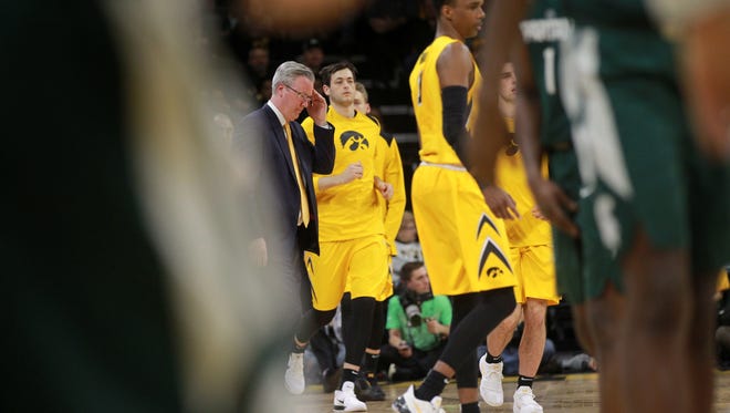 Iowa head coach Fran McCaffery brings players into a timeout during the Hawkeyes' game against Michigan State at Carver-Hawkeye Arena on Tuesday, Feb. 6, 2018.