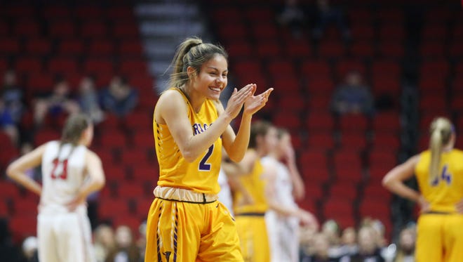 Johnston's Maya McDermott celebrates after her team takes the lead during the Class 5A Girls' state basketball semifinal game between Johnston and Iowa City High on Thursday, March 1, 2018, in Wells Fargo Arena.