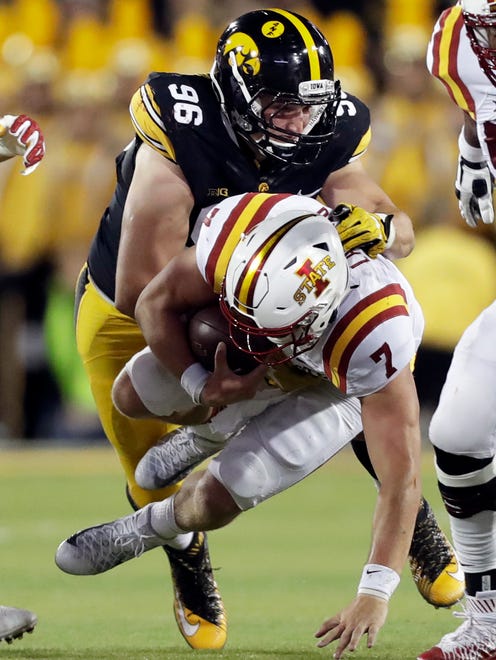 Iowa State quarterback Joel Lanning (7) is sacked by Iowa defensive end Matt Nelson (96) during the first half of an NCAA college football game, Saturday, Sept. 10, 2016, in Iowa City, Iowa. (AP Photo/Charlie Neibergall)