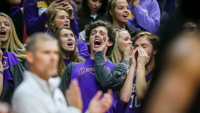 Johnston's fans cheer against Waukee during their first round 5A matchup in the girls' state basketball tournament Monday, Feb. 26, 2018, at Wells Fargo Arena in Des Moines, Iowa. Johnston defeated Waukee 73-48.