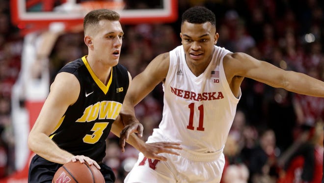 Iowa's Jordan Bohannon (3) drives to the basket against Nebraska's Evan Taylor (11) during the first half of an NCAA college basketball game in Lincoln, Neb., Saturday, Jan. 27, 2018. (AP Photo/Nati Harnik)
