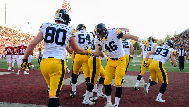 Iowa Hawkeyes tight end George Kittle (46) and Iowa Hawkeyes tight end Henry Krieger Coble (80) celebrate a touchdown during the first half of the game against the Indiana Hoosiers at Memorial Stadium.