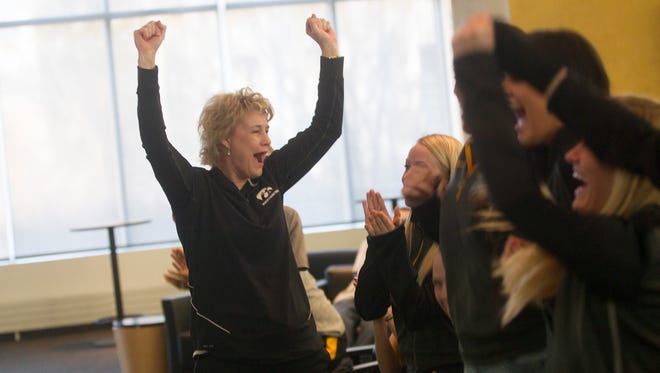 Iowa head coach Lisa Bluder celebrates with her team, coaching staff and family as the Hawkeyes go into the 2015 NCAA women's basketball tournament as a No. 3 seed, starting in Iowa City, during a watch party at Carver-Hawkeye Arena on March 16, 2015.