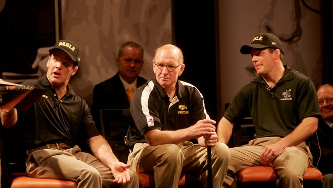 Terry, left, and Tom Brands spoke during "This Is Your Life, Dan Gable" at the Coralville Marriott Hotel and Convention Center kicking off FryFest 2011 on Sept. 2 in Coralville.