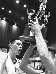 Street and his Indianola teammates hold up the consolation trophy after beating Ankeny at the boys state basketball tournament in 1990.