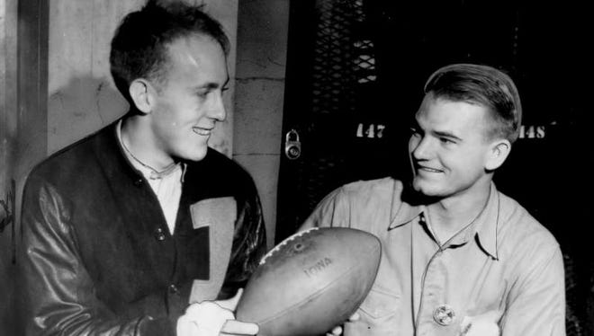 Nov. 12, 1939 - Holding the ball that sailed over the crossbar for the deciding extra point in a 7-6 win over Notre Dame are Iowa's captain Erwin Prasse, left end, and Nile Kinnick.
