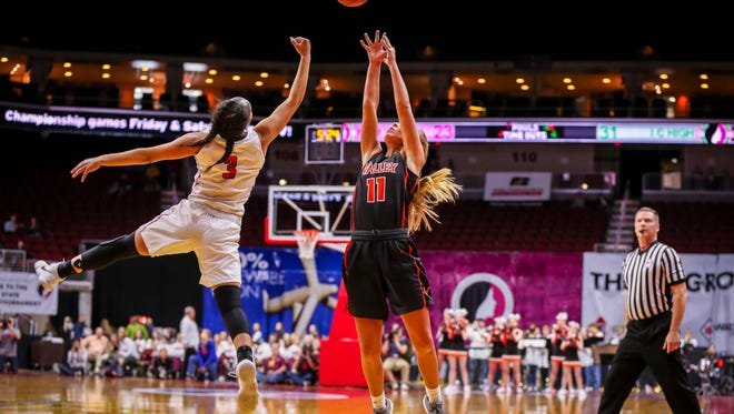 West Des Moines Valley's(11) Shea Fuller and Iowa City High's (3) Rose Nkumu reach for a pass during their first round 5A matchup in the girls' state basketball tournament Monday, Feb. 26, 2018, at Wells Fargo Arena in Des Moines, Iowa.