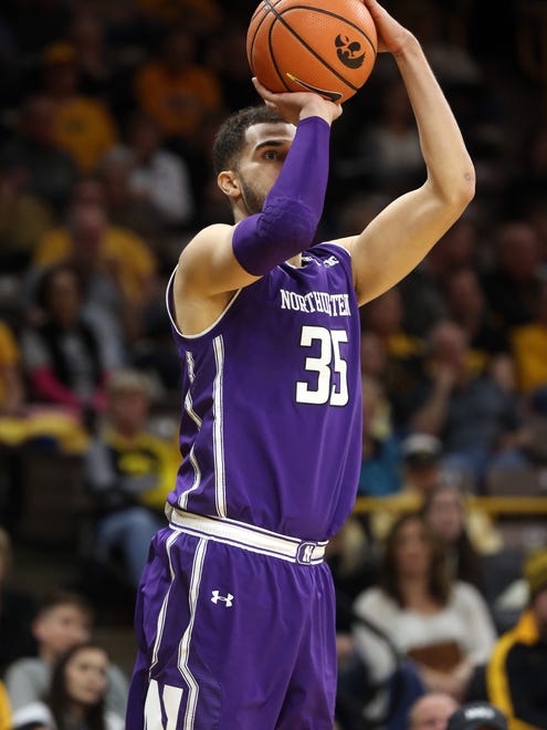 Northwestern's Aaron Faizon takes a shot during the Wildcats' game against Iowa at Carver-Hawkeye Arena on Sunday, Feb. 25, 2018.
