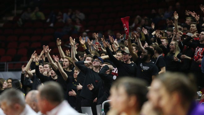 The City High student section cheers during the Class 5A Girls' state basketball semifinal game between Johnston and Iowa City High on Thursday, March 1, 2018, in Wells Fargo Arena. City High won the game, 58-52, to advance to the state final.