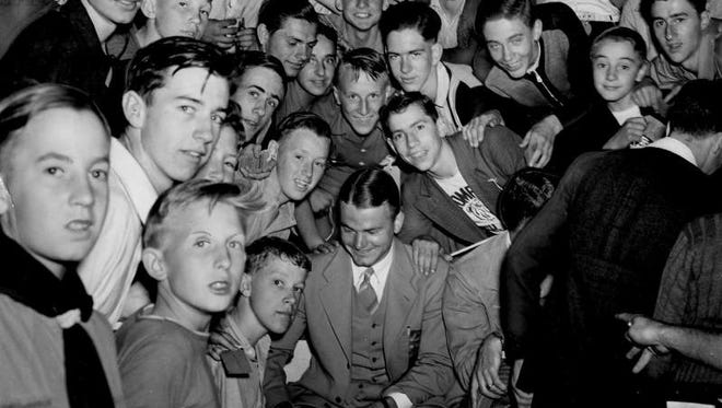 Iowa football star Nile Kinnick, front middle, and coach Eddie Anderson were special guests at a 1940 convention of Des Moines Register carriers. Kinnick was himself a carrier as a boy in Adel.