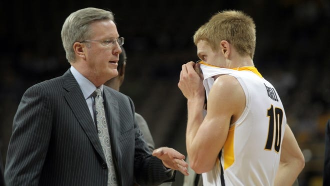 Iowa head coach Fran McCaffery talks to Mike Gesell during their game against South Dakota at Carver-Hawkeye Arena on Tuesday, Dec. 4, 2012.