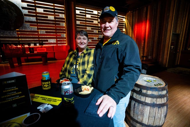 Bruce and Lori Tweeton of Center Point, IA attend the Hawkeye Huddle ahead of the NCAA championship semi final round Friday, March 22, 2024, at the Power and Light District in Kansas City, MO.