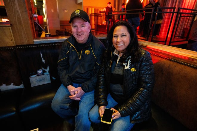 Lance and Christina Lane of Emporia, KS attend the Hawkeye Huddle ahead of the NCAA championship semi final round Friday, March 22, 2024, at the Power and Light District in Kansas City, MO.