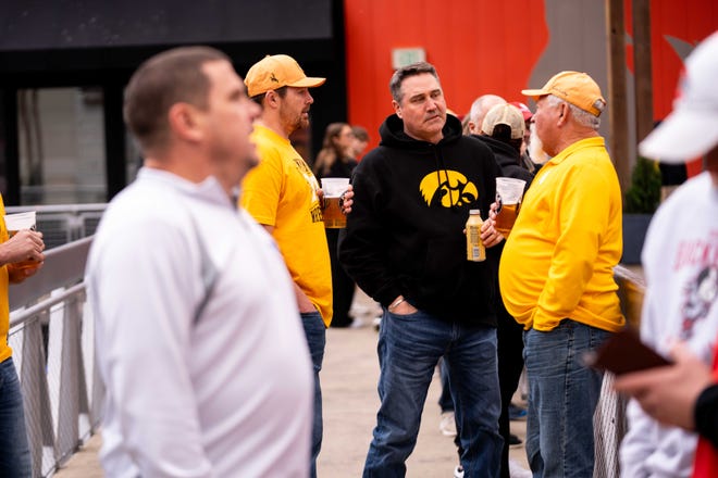 Hawkeye fans attend a Hawkeye Huddle ahead of the NCAA championships semifinal round Friday, March 22, 2024, at the Power and Light District in Kansas City, MO.