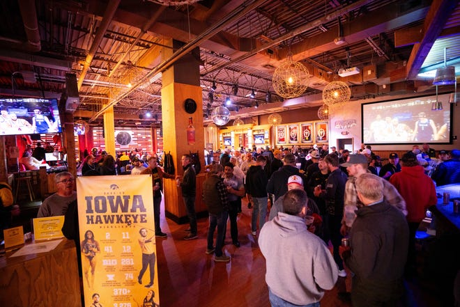 Hawkeye fans attend a Hawkeye Huddle ahead of the NCAA championships semifinal round Friday, March 22, 2024, at the Power and Light District in Kansas City, MO.