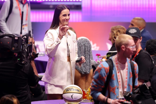 Apr 15, 2024; Brooklyn, NY, USA; Caitlin Clark waves before the 2024 WNBA Draft at Brooklyn Academy of Music. Mandatory Credit: Brad Penner-USA TODAY Sports