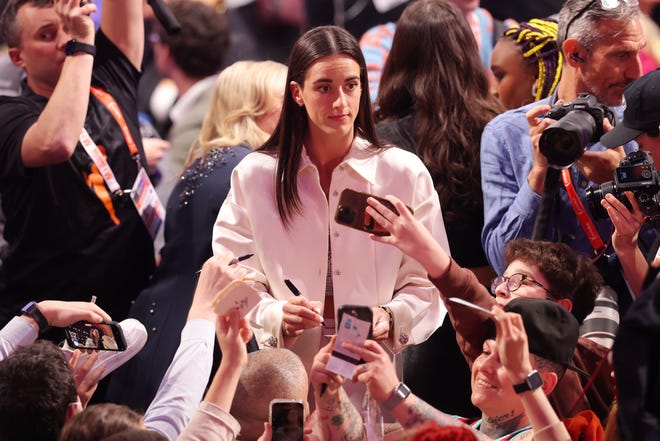 Apr 15, 2024; Brooklyn, NY, USA; Caitlin Clark signs autographs before the 2024 WNBA Draft at Brooklyn Academy of Music. Mandatory Credit: Brad Penner-USA TODAY Sports