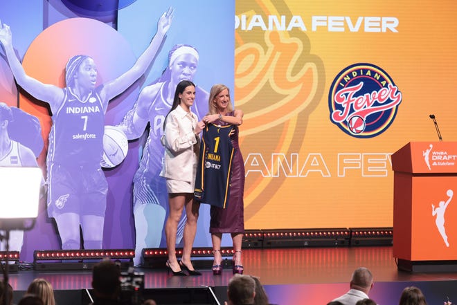 Apr 15, 2024; Brooklyn, NY, USA; Caitlin Clark poses with WNBA commissioner Cathy Engelbert after she is selected with the number one overall pick to the Indiana Fever in the 2024 WNBA Draft at Brooklyn Academy of Music. Mandatory Credit: Vincent Carchietta-USA TODAY Sports