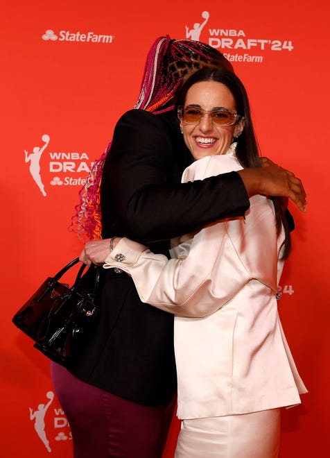 NEW YORK, NEW YORK - APRIL 15: (L-R) Aliyah Boston hugs Caitlin Clark prior to the 2024 WNBA Draft at Brooklyn Academy of Music on April 15, 2024 in New York City. (Photo by Sarah Stier/Getty Images)