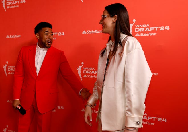 NEW YORK, NEW YORK - APRIL 15: (L-R) Kevin Miles, also known as Jake from State Farm, talks with Caitlin Clark prior to the 2024 WNBA Draft at Brooklyn Academy of Music on April 15, 2024 in New York City. (Photo by Sarah Stier/Getty Images)