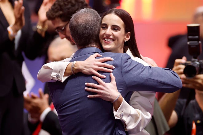 NEW YORK, NEW YORK - APRIL 15: Caitlin Clark celebrates after being selected first overall pick by the Indiana Fever during the 2024 WNBA Draft at Brooklyn Academy of Music on April 15, 2024 in New York City. (Photo by Sarah Stier/Getty Images)