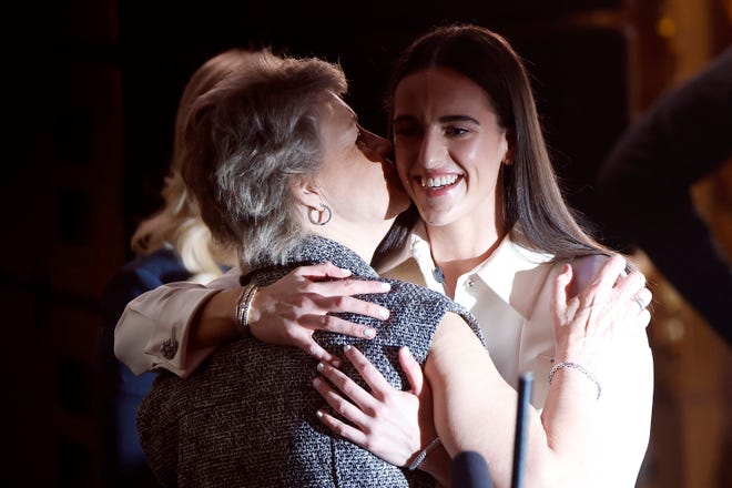 NEW YORK, NEW YORK - APRIL 15: Head coach Lisa Bluder of the Iowa Hawkeyes kisses Caitlin Clark after being selected first overall pick by the Indiana Fever during the 2024 WNBA Draft at Brooklyn Academy of Music on April 15, 2024 in New York City. (Photo by Sarah Stier/Getty Images)