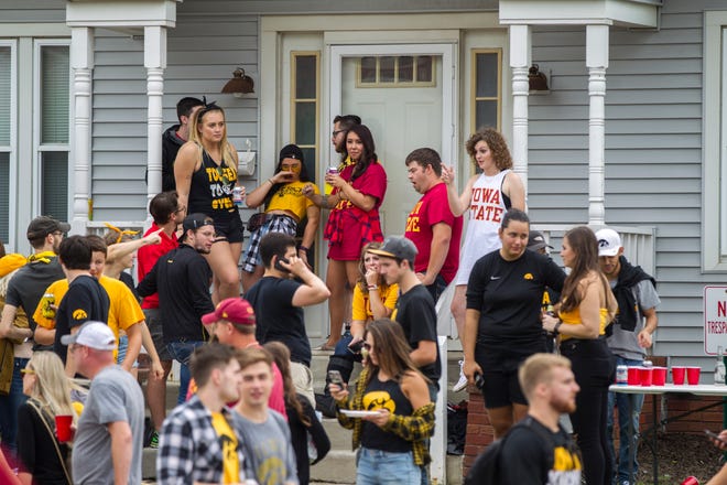Fans tailgate off of Melrose Avenue before the Cy-Hawk NCAA football game on Saturday, Sept. 8, 2018, at Kinnick Stadium in Iowa City.