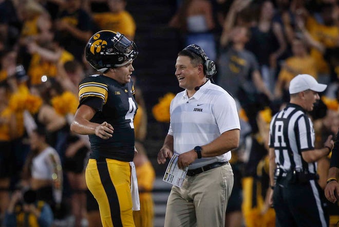 Iowa quarterback Nate Stanley speaks with offensive coordinator Brian Ferentz during a time out against Northern Iowa on Saturday, Sept. 15, 2018, at Kinnick Stadium in Iowa City.